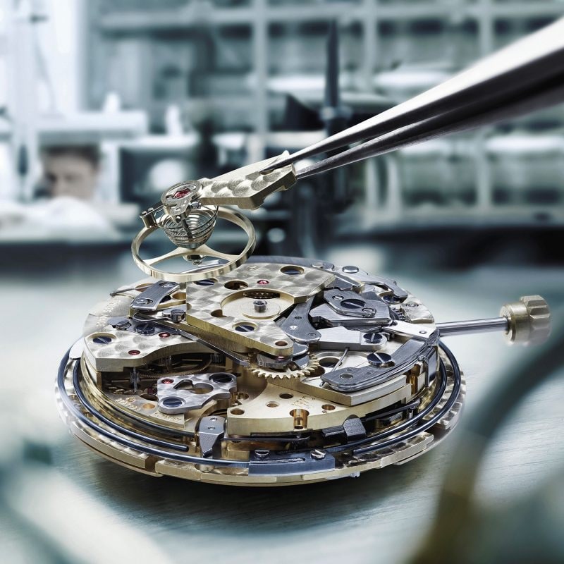 Close-up image of IWC watch mechanism and components inside watch dial,Close-up image of IWC watch mechanism and components inside watch dial