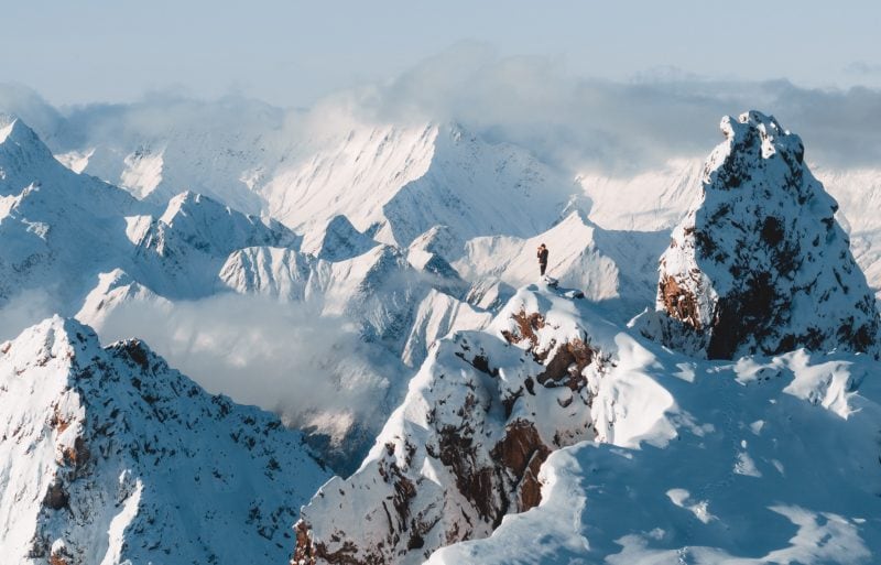 The Alpinists Jon Guler on Piz Fess overlooking the Signina mountain range,