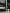 男士站在汽車存放設施內，後面展示多輛不同款式的Mercedes-Benz 