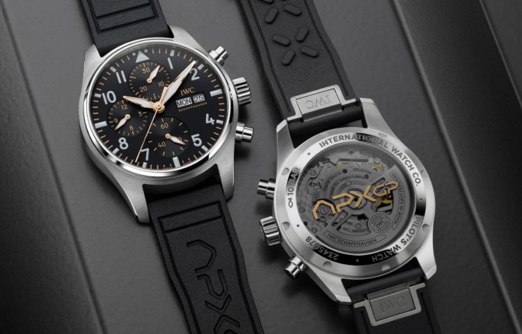 Two Pilot’s Watch Chronograph APXGP (IW378009) watches side by side front and back shot with black dial, stainless steel case and black rubber strap.