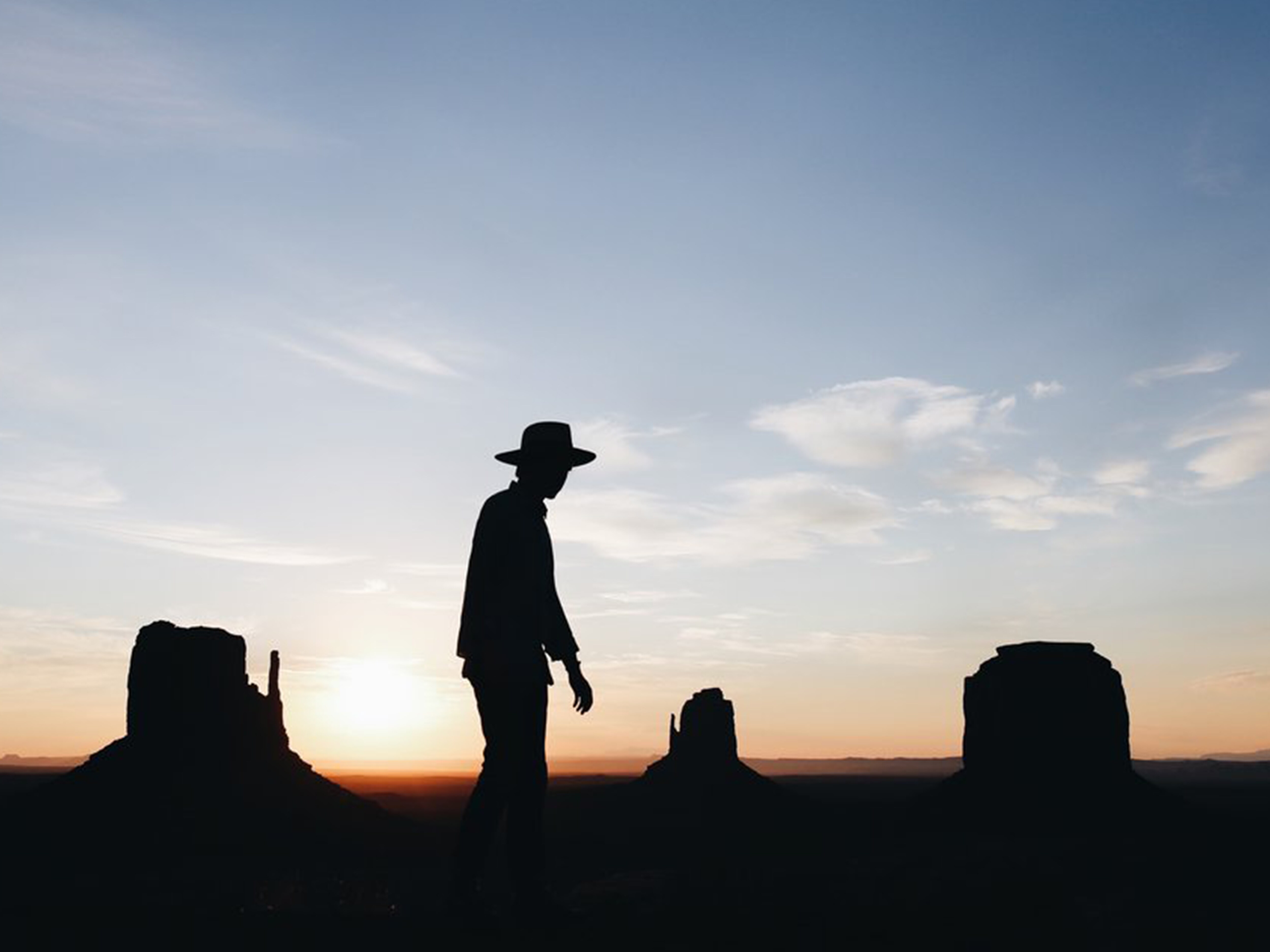 Christopher playing cowboys in the Monument Valley