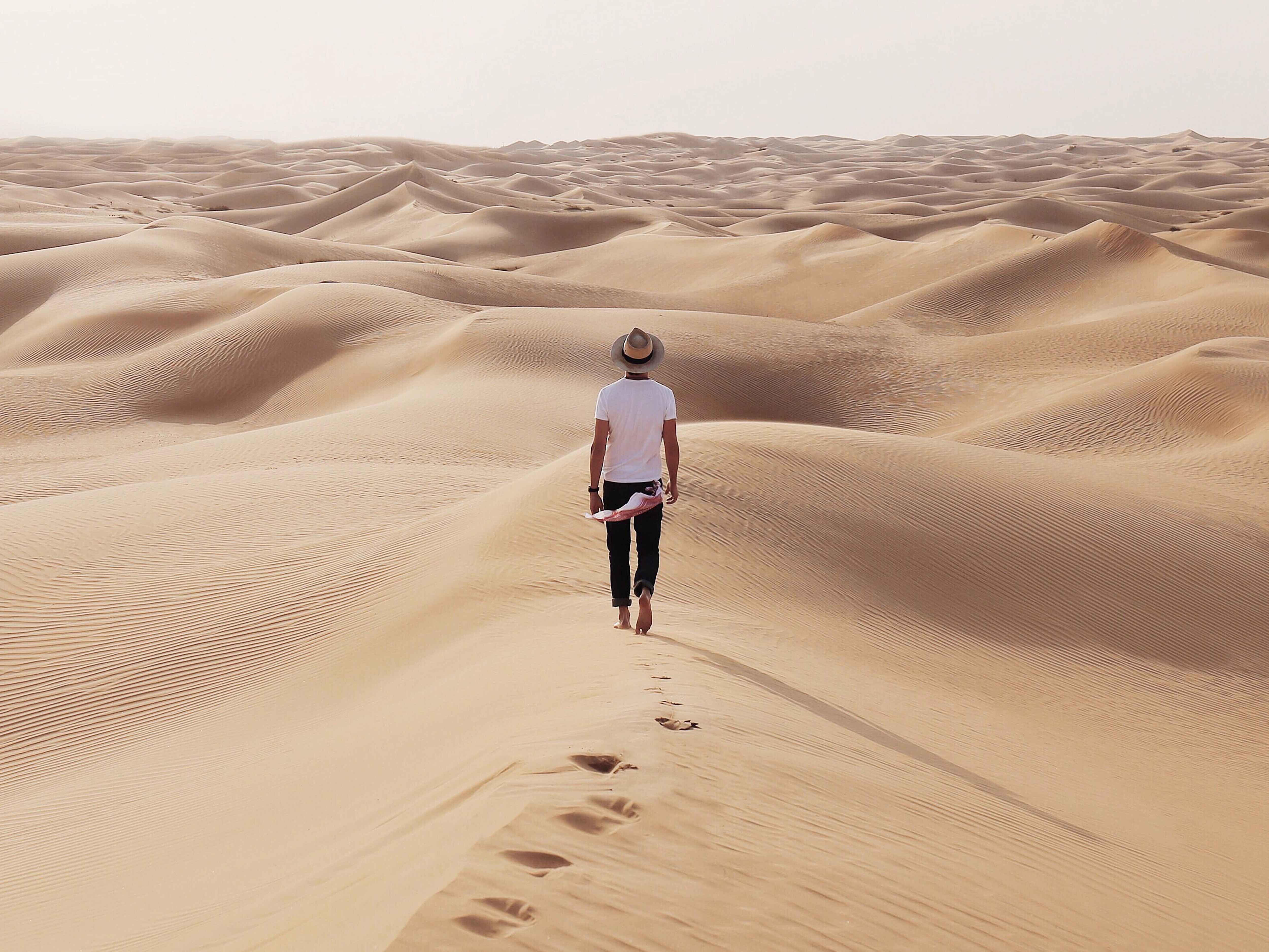 Christopher walking in the desert in Dubai
