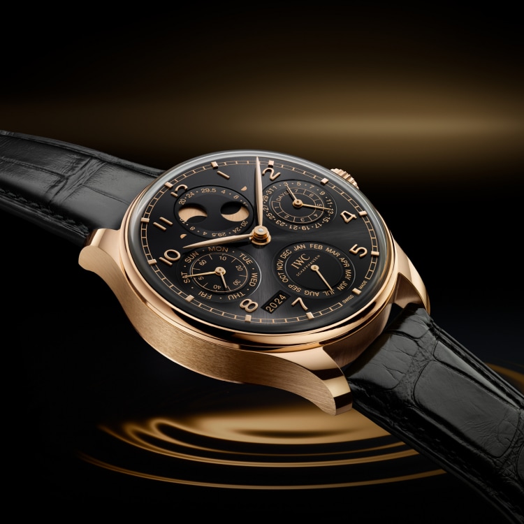 Image of IWC IW503702 PORTUGIESER PERPETUAL CALENDAR with black dial, 18 ct Armor Gold® case and black leather strap