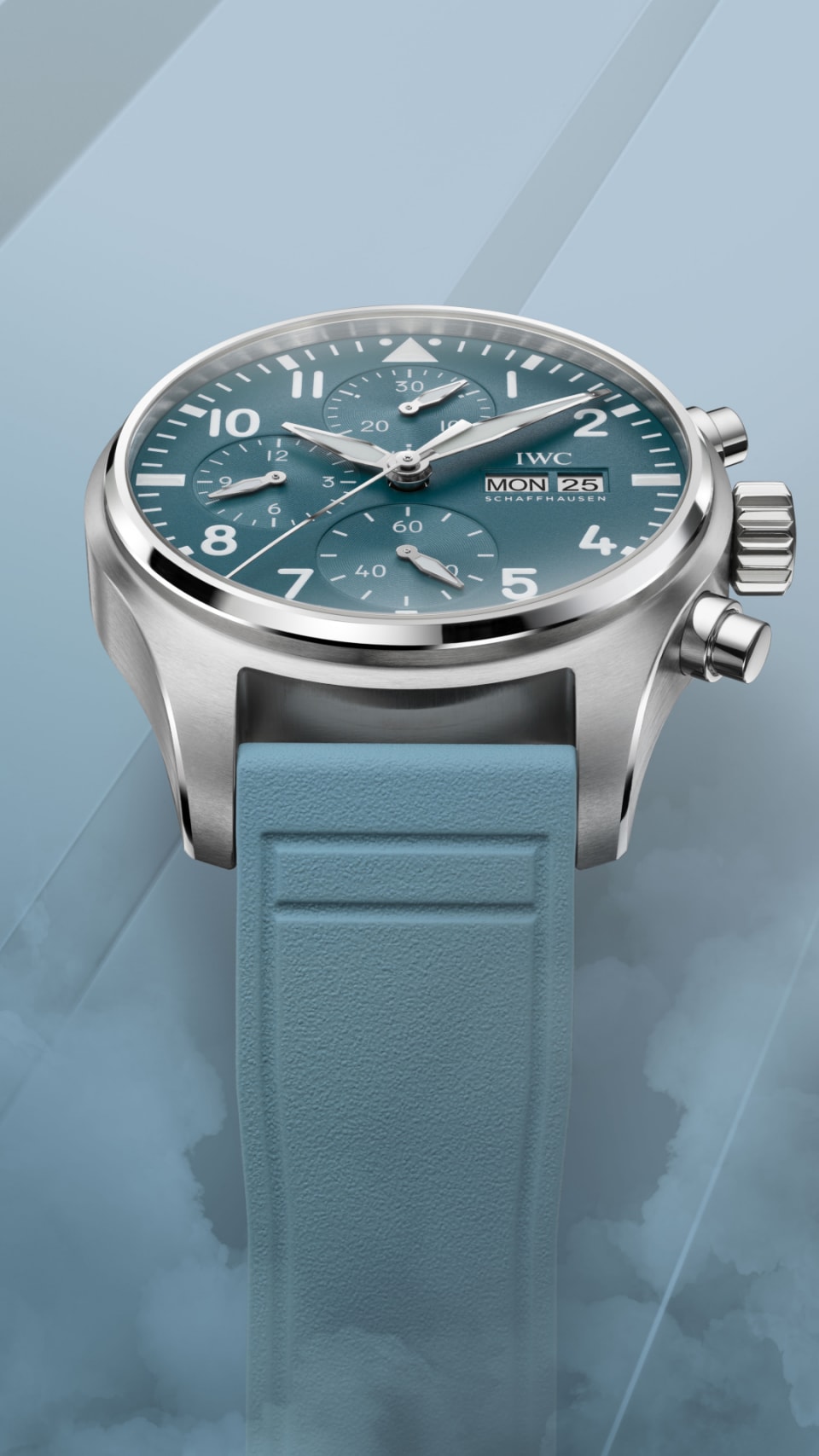 Pilot's Watch Chronograph 41 with light blue dial, light blue rubber strap and stainless steel case on blue misty background.