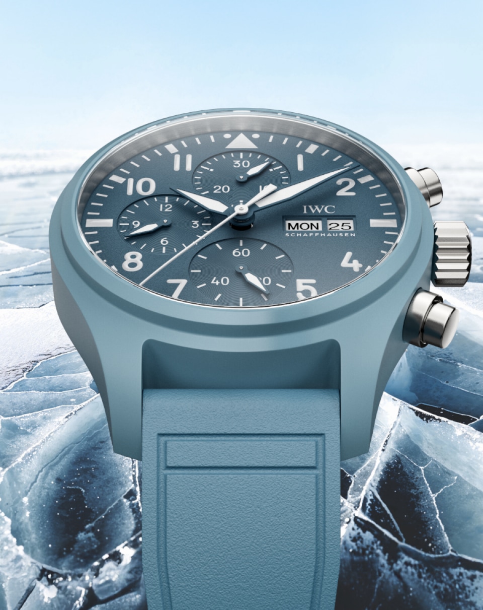 Pilot's Watch Chronograph 41 with light blue dial, light blue rubber strap and stainless steel case on blue misty background.