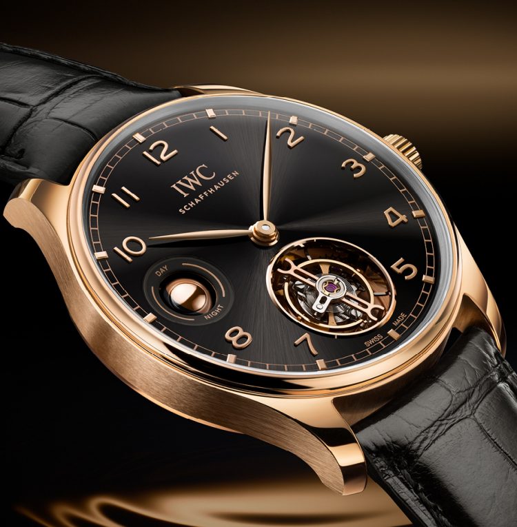 IWC Portugieser Hand-Wound Tourbillon Day & Night with black case, 18 ct Armor Gold® case and black alligator leather strap by Santoni.