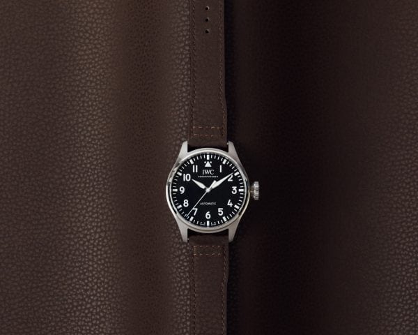 Front image of a watch with brown alternative leather strap