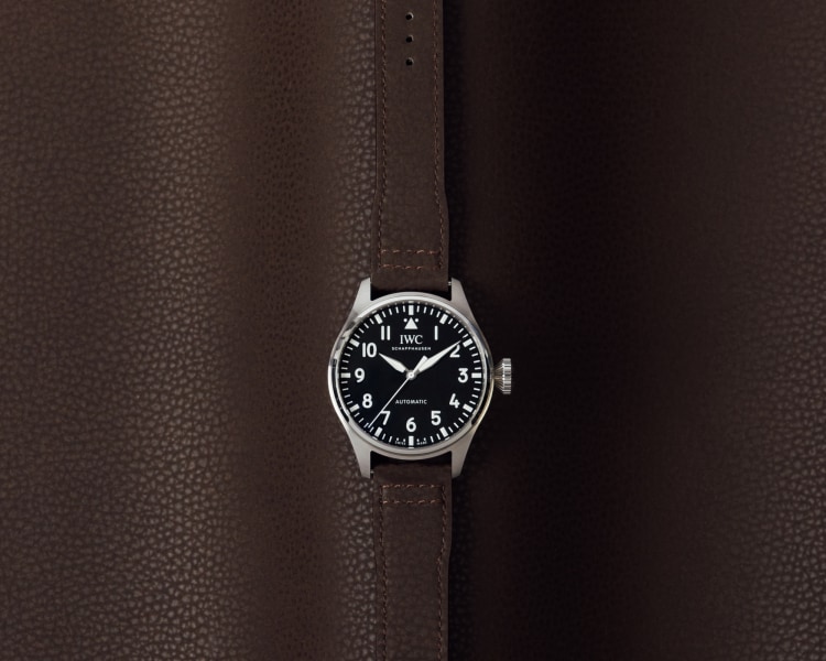 Front image of a watch with brown alternative leather strap