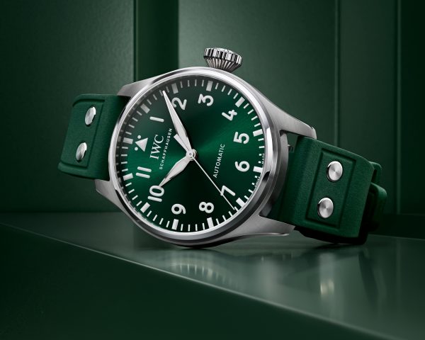 Front image of a green dial watch with a green rubber strap